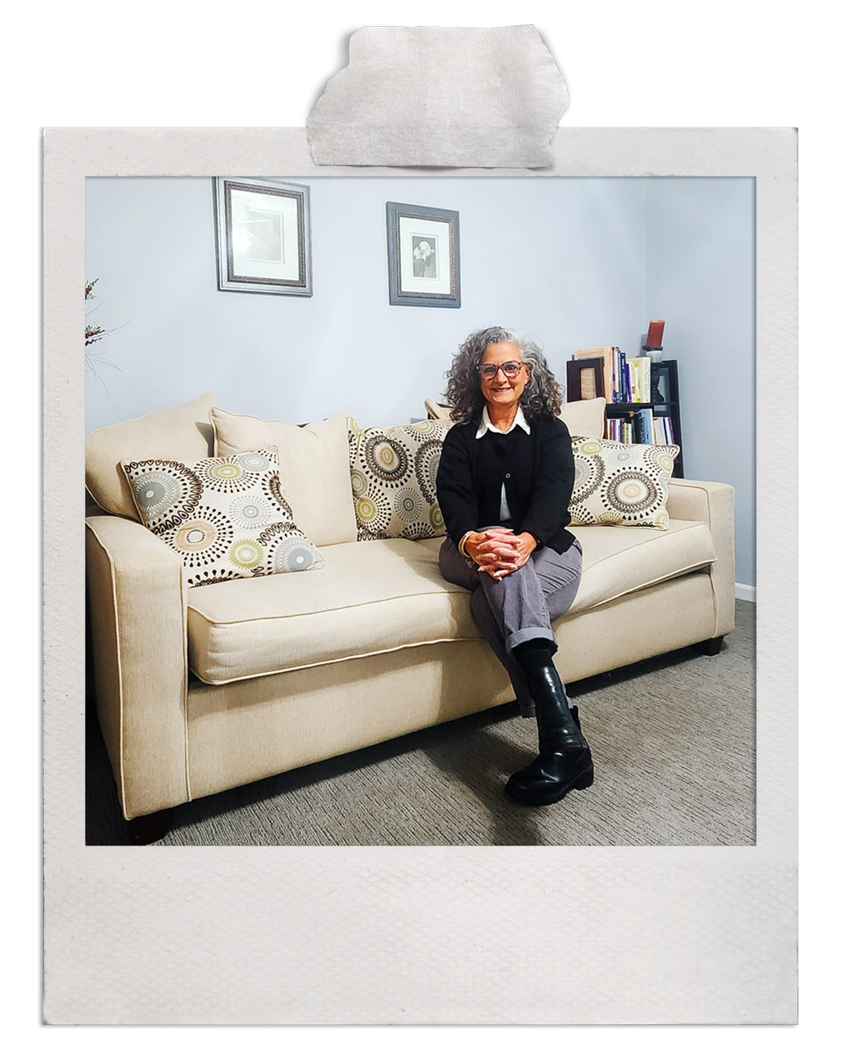 Denver therapist Ilia Jones LPC welcoming clients in comfortable counseling office with beige sofa